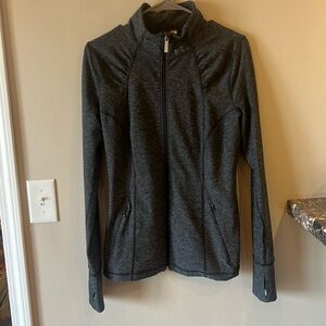 Woman’s Under Armour full zip active top greyv